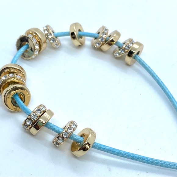 KENNETH COLE Slider Bracelet Goldtone and Blue Cording - Picture 3 of 5